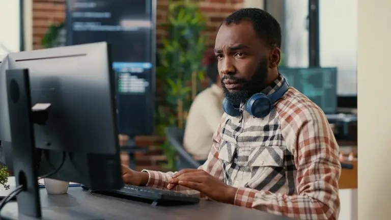 computer user wearing headphones